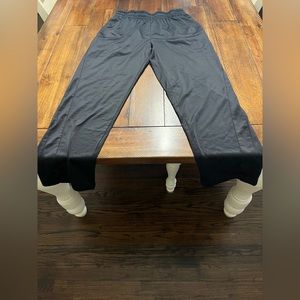 A pair of black Tek gear sweatpants.